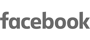 The word facebook is written in lowercase gray letters using the social media platform’s recognizable logo font on a light background—ideal for a workplace wellbeing speaker discussing burnout prevention and leadership self-care in digital spaces.