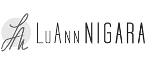 Logo for LuAnn Nigara, a women’s leadership development and corporate wellness speaker, featuring a script monogram L N inside a light gray circle, with LuAnn NIGARA in a mix of thin and bold black lettering.