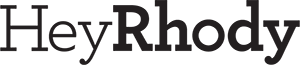 Black text on a light gray background spelling Hey Rhody in a serif font.
